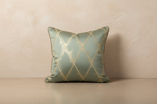 Decorative pillow with gold geometric pattern on a light blue background
